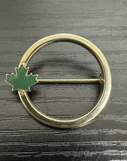 Unsigned Circular Gold-Toned Brooch with a Green Enamel Canadian Maple Leaf
