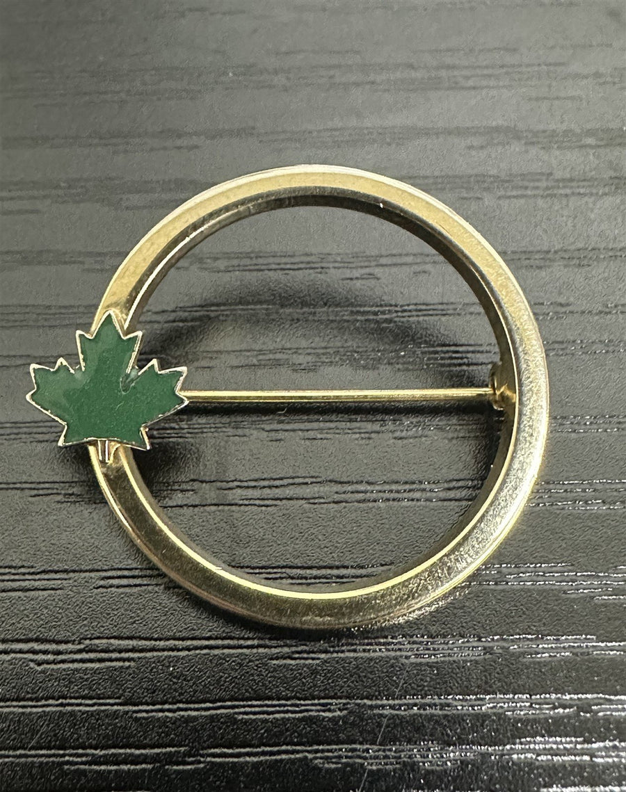 Unsigned Circular Gold-Toned Brooch with a Green Enamel Canadian Maple Leaf